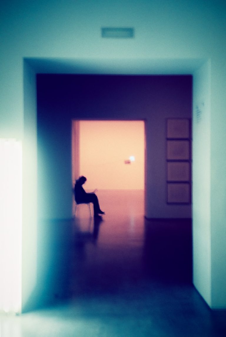 a person sitting on a chair in a room