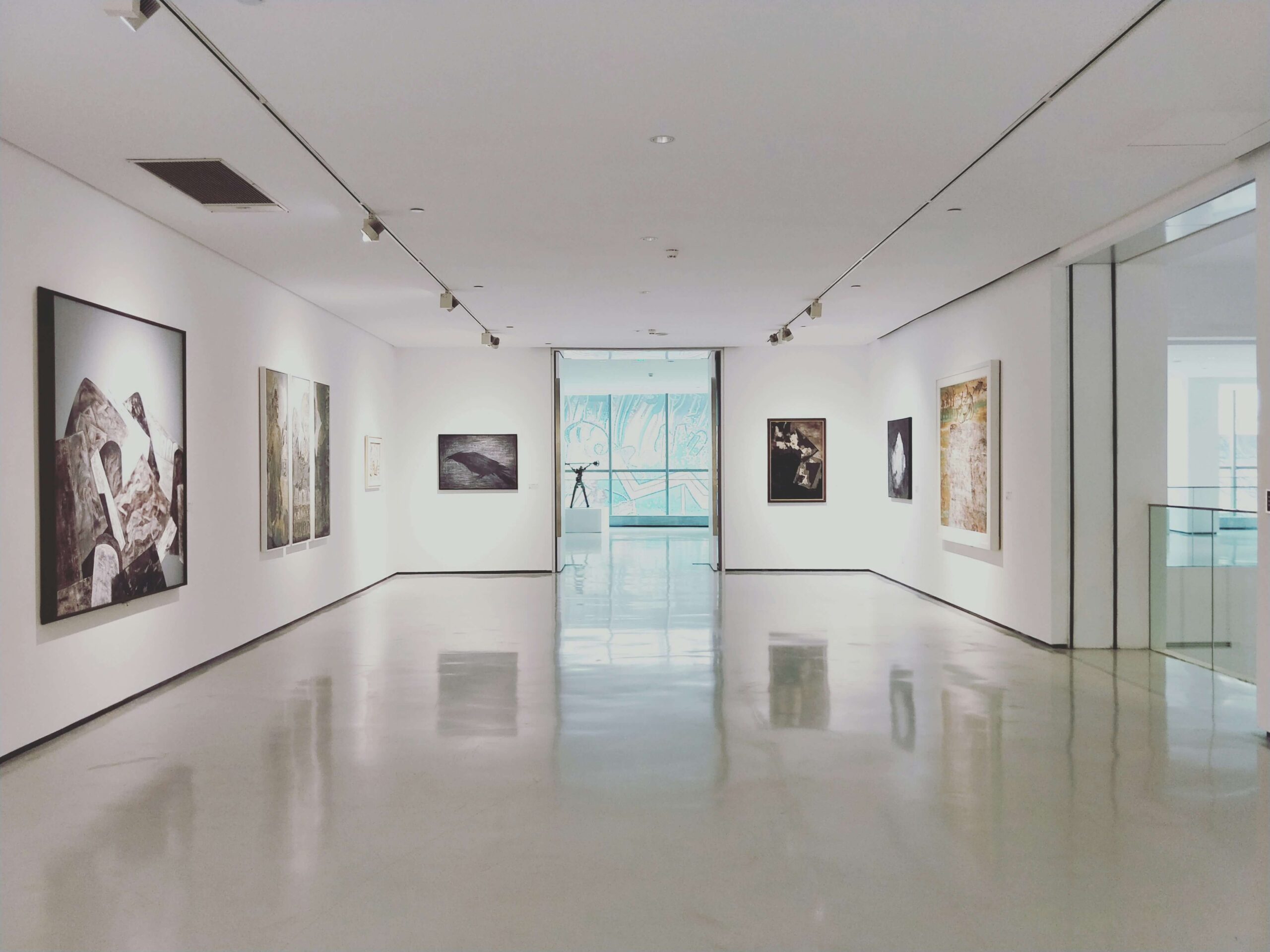 An art gallery view with paintings that require an art marketing agency